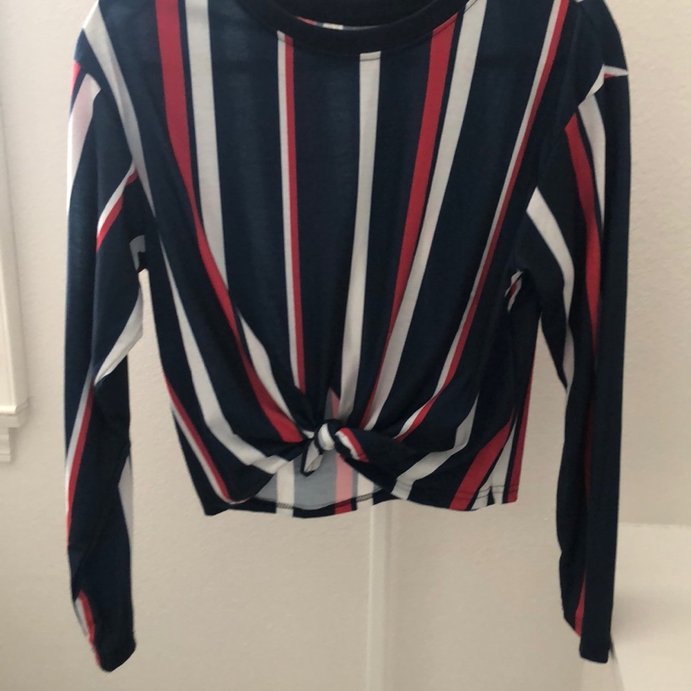 long sleeve red white and blue. tie in the front.
